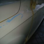 Before and after photographs of a damaged white, AUDI Quattro SUV that was repaired by Elite Paint & Body Shop in West Palm Beach, Florida.